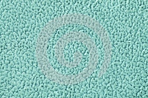 Turquoise background of soft, fleecy cloth. Texture of textile closeup