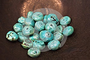 Turquoise beads on bronze