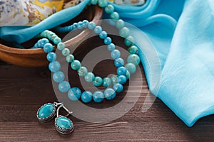 Turquoise beads on shawl