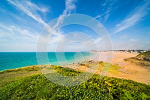 Turquoise Blue Atlantic Coast and Beach of PlÃ©neuf-Val-AndrÃ© in Brittany France on a Sunny Summer Day