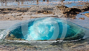 The turquoise blue boiling bubble of Strokkur Geyser before eruption. Gold Circle. Iceland