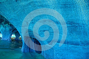 Turquoise blue lines on marble rock formation at Marble caves or Cuevas de Marmol at turquoise General Cerrerra Lake. Location