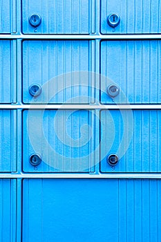 Turquoise blue mailbox with numbered keyholes