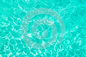 Turquoise blue ripped swimming pool water background summer concept