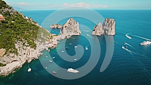 Turquoise blue sea on Capri at the Da Luigi Beach Club. Aerial view of summer paradise island in Italy.