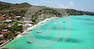 Turquoise clear water. Yachts, boats floating. Water Gradient from light to dark blue. Phi Phi don island.