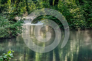 Turquoise color of water in the summer on the river Janj