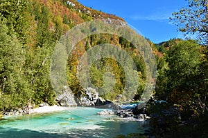 Turquoise colored Soca river in Trenta valley, Primorska, Slovenia photo