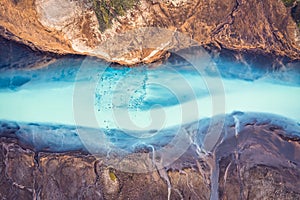 Turquoise glacier river flowing melting in Icelandic highlands on summer at Iceland