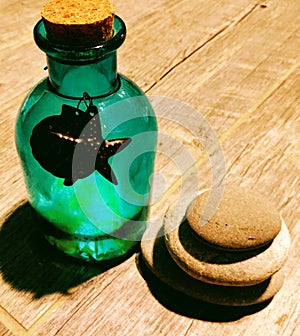 Turquoise Glass Bottle and Zen Balanced Stones 2