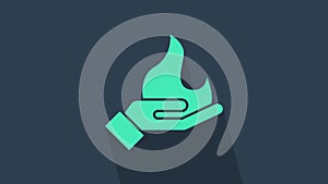 Turquoise Hand holding a fire icon isolated on blue background. 4K Video motion graphic animation