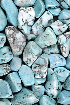 Turquoise heap stones texture on black background