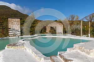 turquoise hot spring pools in white gypsum baths in Bagni San Filippo in Tuscany