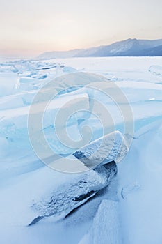 Turquoise ice floes. Winter sunset landscape