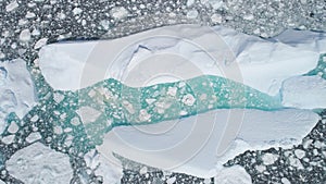 Turquoise iceberg brash ice aerial top down view