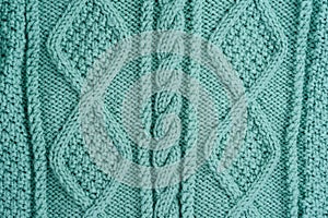 Turquoise Knitted woolen background. Textured, Patterned