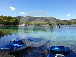 Turquoise lake Banyoles with boats, Spain