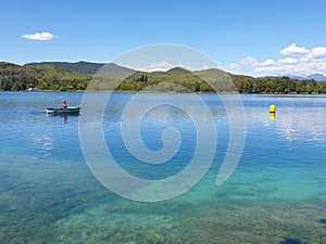 Turquoise lake Banyoles with boats, Spain