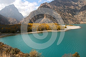 Turquoise Lake Iskanderkul Iskander Kul Fann mountains, Tajikistan, Central Asia. Reflection of Lake Iskanderkul