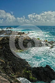 Turquoise ocean and caggy rocks