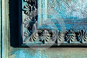 Turquoise patinated bronze archiectural detail. photo