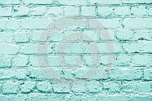Turquoise rough brick wall close-up