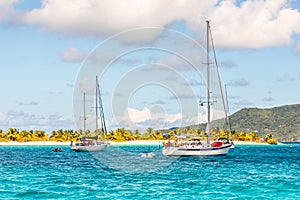 Turquoise sea and anchored yachts at Sandy beach island, near Carriacou island, Grenada, Caribbean sea