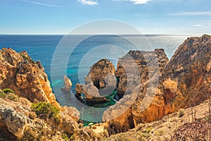 Turquoise sea bay among rocks and cliffs at Ponta da Piedade near Lagos, Algarve region, Portugal