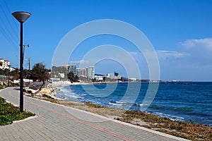 Turquoise sea and coastline on a bright sunny day. Travel to the island of Cyprus, Limassol photo