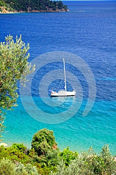 Turquoise sea and a sailing boat, Greece
