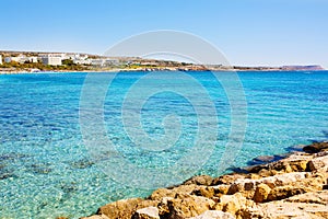 Turquoise sea water. Rocky coast