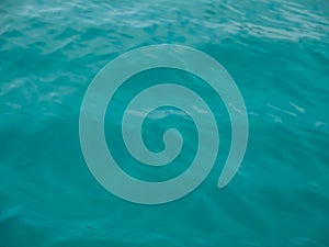 Turquoise sea wave splashing overboard