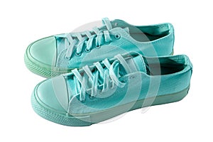 Turquoise sneakers isolated. A pair of mint shoes. Sports shoe.