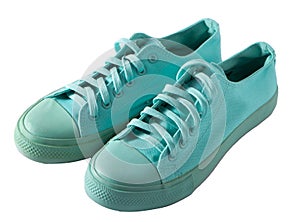 Turquoise sneakers isolated. A pair of mint shoes. Sports shoe.