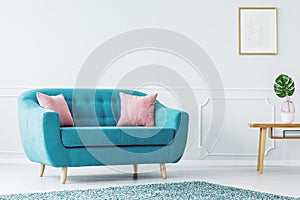Turquoise sofa in minimalist interior