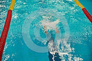 Turquoise swimming pool lanes, a symbol of sport