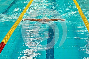 Turquoise swimming pool lanes, a symbol of sport