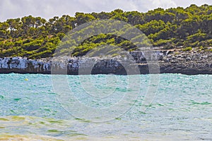 Turquoise water and cliffs bay CalÃ³ dâ€™en Garrot Mallorca