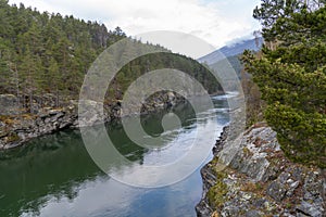 Turquoise water in the Finna River near the village of Vagamo in Norway