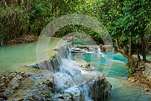 Turquoise water of Kuang Si waterfall, Luang Prabang, Laos. Tropical rainforest. The beauty of nature