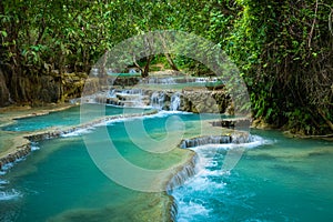 Turquoise water of Kuang Si waterfall, Luang Prabang, Laos. Tropical rainforest. The beauty of nature