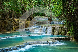 Turquoise water of Kuang Si waterfall, Luang Prabang, Laos. Tropical rainforest. The beauty of nature