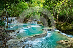 Turquoise water of Kuang Si waterfall, Luang Prabang, Laos. Tropical rainforest. The beauty of nature