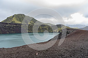 Turquoise water Ljotipollur in Iceland photo