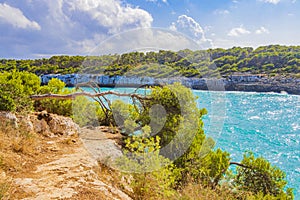 Turquoise water and nature walking path at bay Mallorca Spain