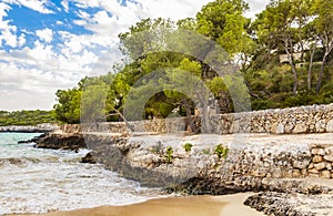 Turquoise water and nature walking path at bay Mallorca Spain