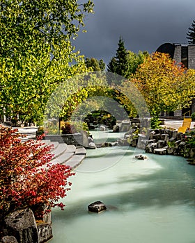The turquoise water of the Pond in Village Park on the Village Stroll at the Olympic Plaza in the Village of Whistler