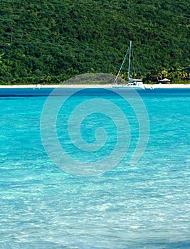 Turquoise water of the sea with a moored boat