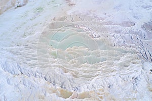 Turquoise water of thermal source in the white natural pools. Pamukkale travertine aerial landscape