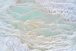 Turquoise water of thermal source in the white natural pools. Pamukkale travertine aerial landscape